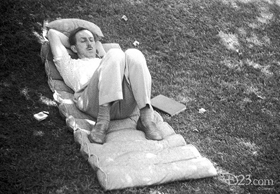 This never-before-released photo, taken with Walt’s personal camera, show Walt sleeping in the shade on the lawn of his Woking Way home on a state-of-the-art '40-s cushion—a book at his side.